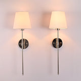 Front pair view of Milan white shade chrome rod wall sconces with slim vertical frame and round backplates.