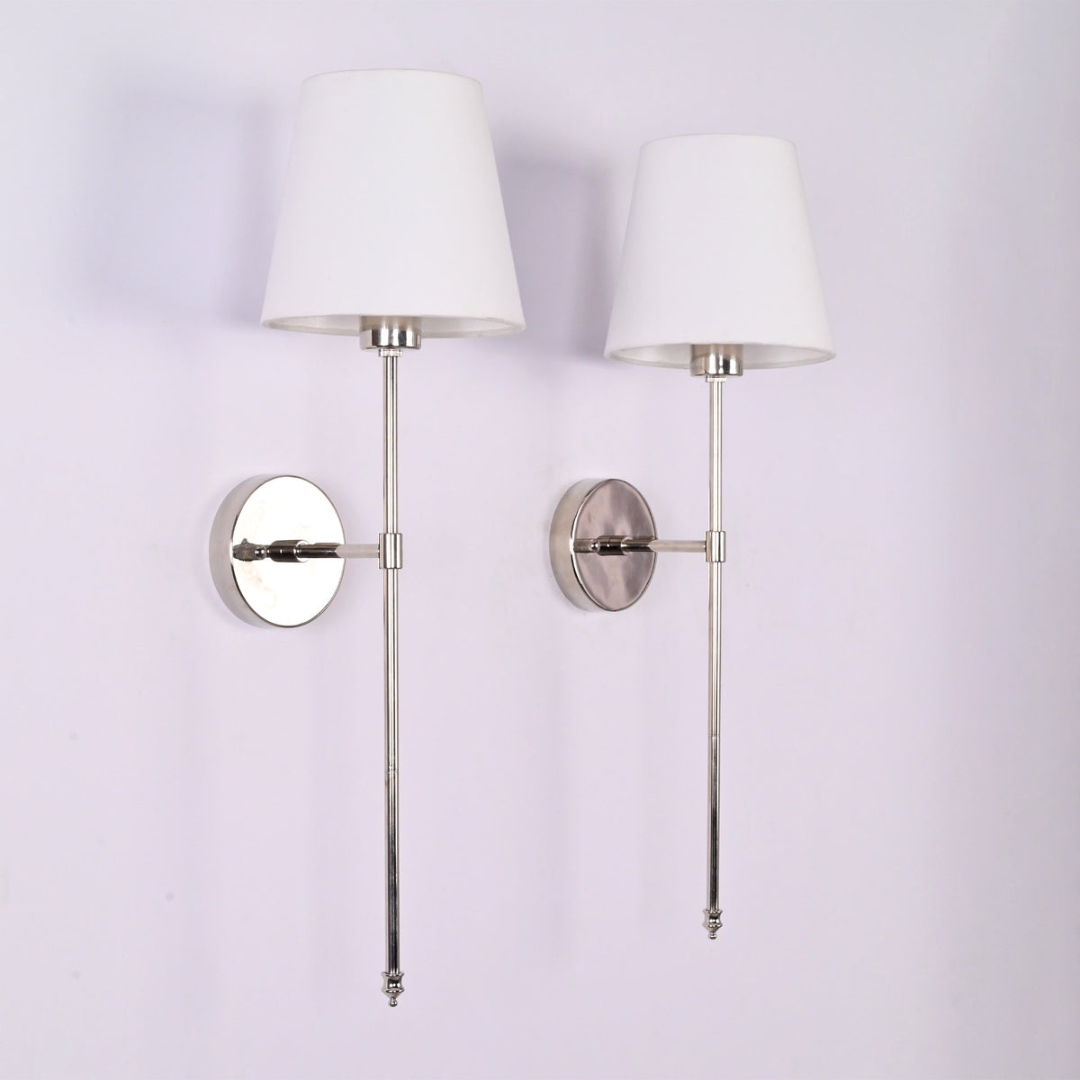 Side profile of Milan chrome rod wall sconce with white tapered shade and 8 inch wall projection.