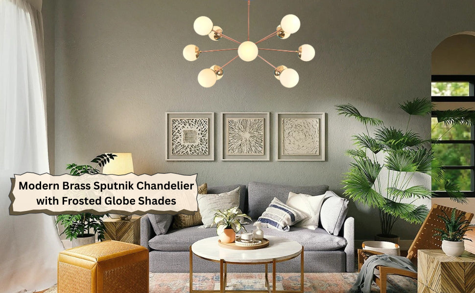 Contemporary living room with a brass Sputnik chandelier featuring frosted globe shades, complementing a grey sofa, wall art, and lush green plants.