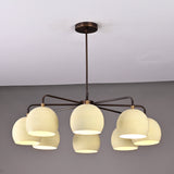 Stylish ceiling chandelier with eight frosted glass globes and a dark metal frame, ideal for contemporary dining or living spaces.