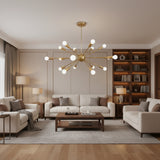 Monaco 18 light Sputnik chandelier in brass finish with radiating arms and exposed globe bulbs, shown from the front.