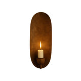 Front view of the Monroe modern oval backplate candle wall sconce in an antique brass finish with a flame-style candle bulb.