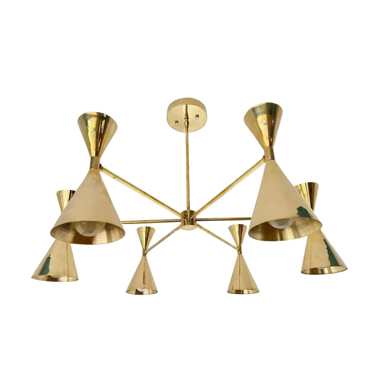 Detailed view of Montpellier 6 light brass chandelier highlighting reflective gold-tone cone shades, metal construction and architectural branching arms.