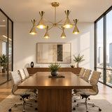 Montpellier 6 light gold-tone chandelier with all six cone shades illuminated, creating a warm downward glow and elegant Mid-Century Modern appearance.