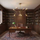 Munich 8 light brass multi-arm chandelier shown from an angled view with branching arms and exposed globe bulbs.