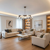 Mykonos 12 light curved arm Sputnik chandelier shown from an angled view with dark tapered socket covers and brass-toned frame.