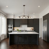 Mykonos 12 light Sputnik chandelier shown from the front with sweeping curved arms, exposed globe bulbs and dark socket details.