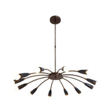 Mykonos 12 light curved arm Sputnik chandelier illuminated in an elegant living room with warm ambient lighting.