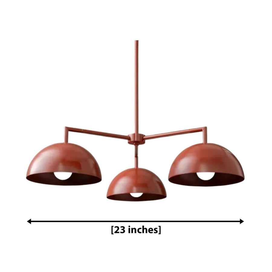 Nantes 3 light terracotta dome chandelier displayed above a modern kitchen island with warm ambient lighting.