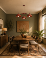 Nantes 3 light terracotta dome chandelier centered above a wooden dining table in a warm Mid-Century Modern dining room.