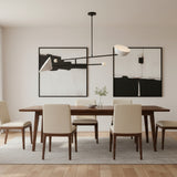 Nashville 2 light balance chandelier shown from an alternate angle with sculptural white shades and elongated black arms.