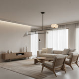 Nashville 2 light Mid-Century Modern chandelier shown from the front with contrasting white shades, spherical accents, and black linear arms.
