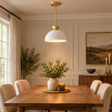 Naxos 1 light white dome pendant shown from the front with warm brass-tone accents, slim downrod and round ceiling canopy.