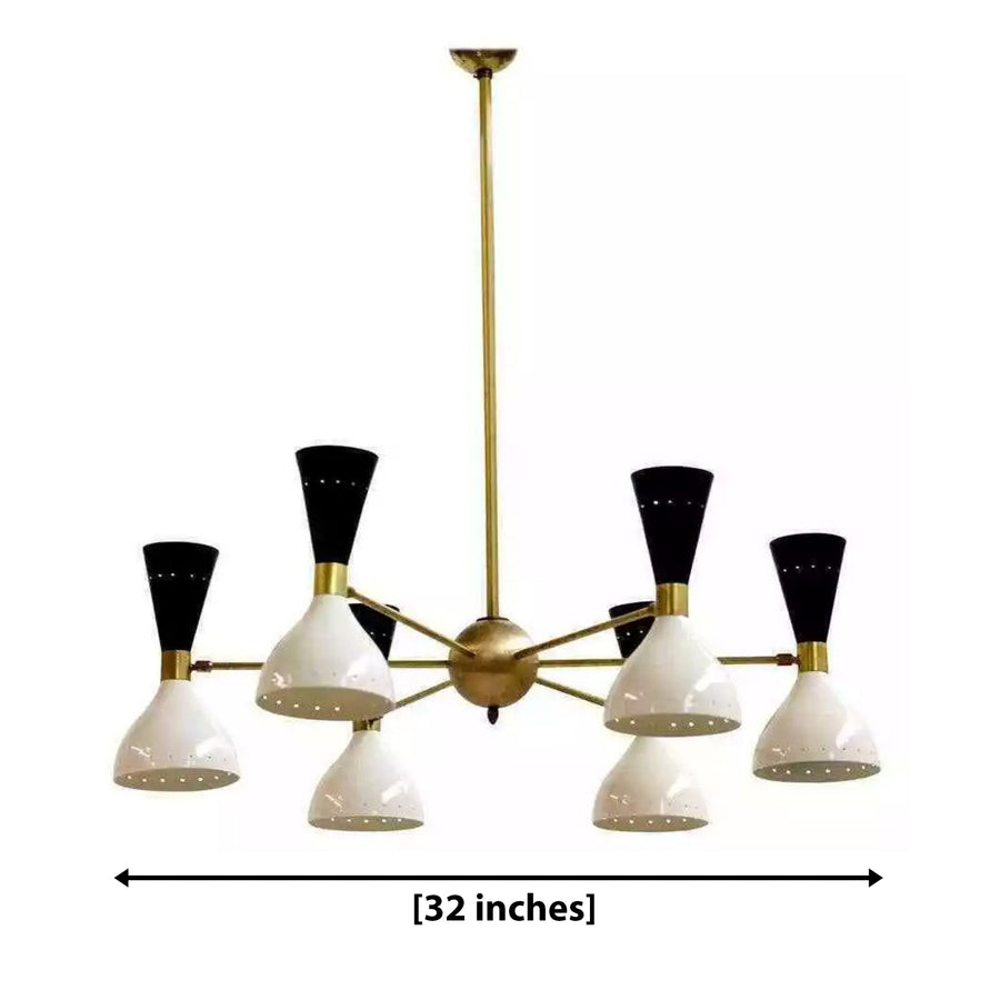 Notting Hill 12 light black and ivory cone chandelier centered above a modern wooden dining table with warm ambient lighting.