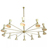 Detailed view of Orion 12 light radial chandelier featuring ivory cone shades, brass arms and central sphere hub