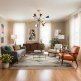 Orion 12-light Sputnik chandelier with colorful cone shades illuminated to showcase its Mid-Century Modern starburst design.