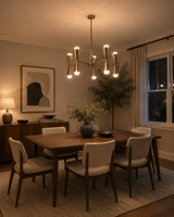 Orion 10-light brass double cone chandelier installed above a dining table in a warm modern dining room.