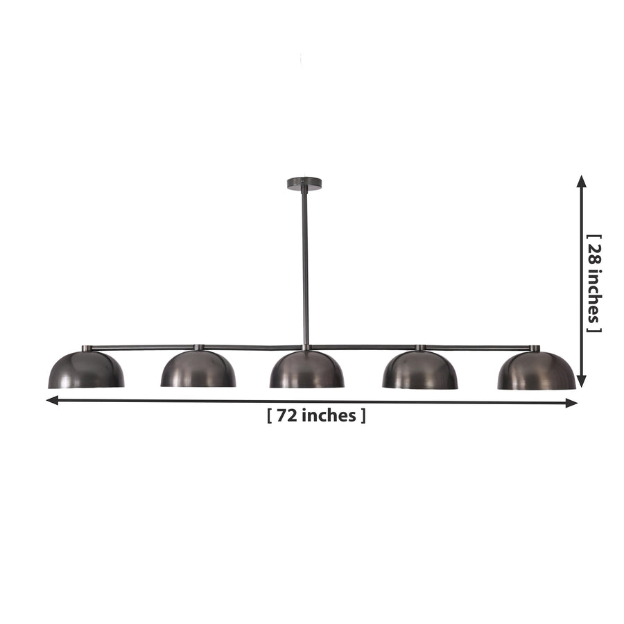 Orion 72-inch 5-light linear dome chandelier installed above a modern dining table, adding warm industrial lighting to a contemporary dining room.