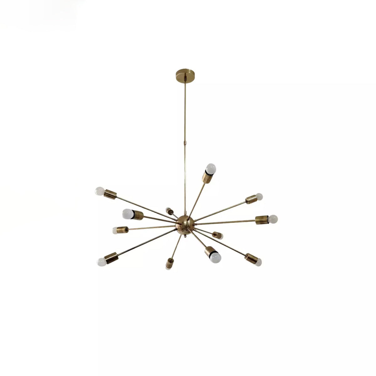 Orion 12 light brass Sputnik ceiling chandelier with radiating arms and exposed globe bulbs, angled view