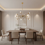 Orion 12 light Mid-Century Modern Sputnik chandelier in brass finish with illuminated exposed bulbs