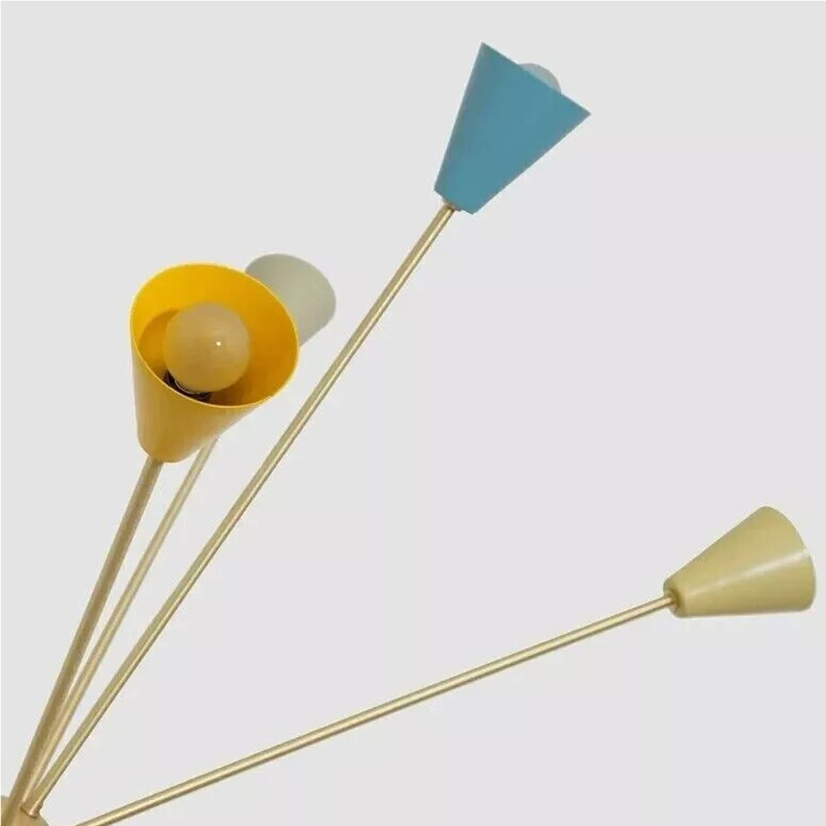 Close-up detail of the handcrafted tapered cone shades on the Orion 16-Light Multicolor Sputnik Chandelier highlighting the vibrant mustard yellow, ivory, and blue finishes.