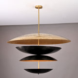 Modern tiered chandelier featuring a layered design with matte black and antique gold dome-shaped discs, suspended from a gold rod, perfect for adding elegance and visual intrigue to contemporary interiors.