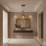 Angled view of Orion 3 light brass pendant chandelier with staggered hourglass double cone shades.