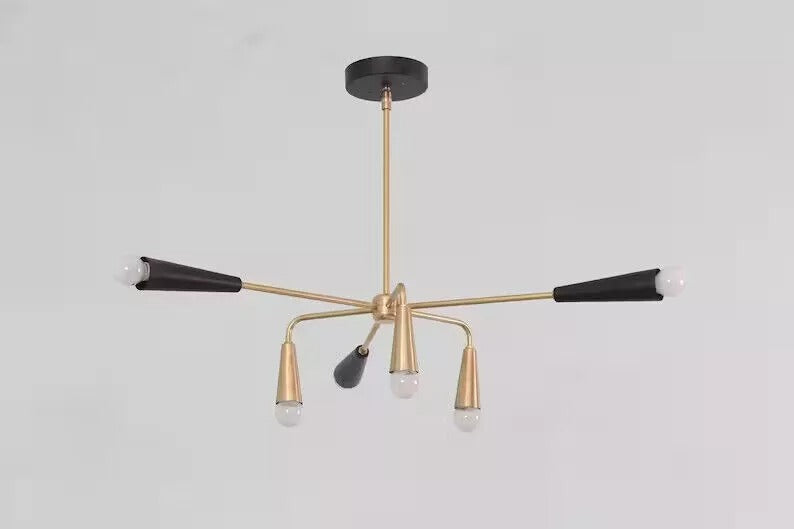 Full hanging view of the Osaka 6-light Mid-Century Modern chandelier showcasing its black and brass-tone finish, sculptural curved arms, tapered cone holders, and round ceiling canopy.