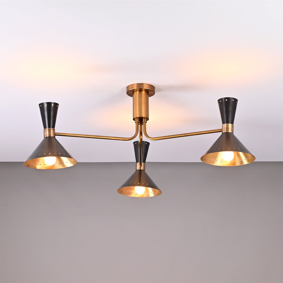 Front view of Oslo Cone Arm Chandelier with three cone shades, slim arms, and compact ceiling mount.