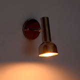 Side illuminated view of Oslo modern polished nickel task wall sconce with handcrafted spotlight shade creating precise directional lighting.