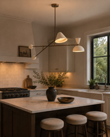 Oslo 2 light sculptural balance chandelier installed above a kitchen island in a warm modern kitchen interior, Model 62014