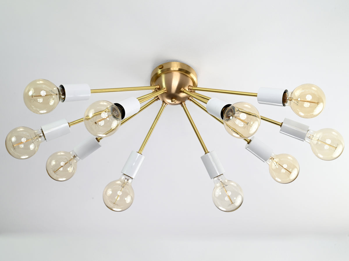 Oslo Sputnik flush mount chandelier featuring ten radial arms, white cylindrical sockets, and a compact Mid-Century Modern design.