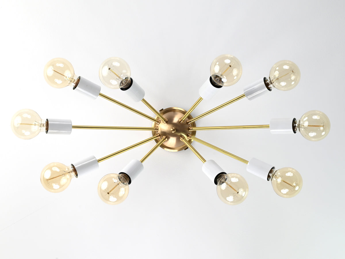 Bottom view of Oslo Sputnik ceiling light showcasing symmetrical ten-arm arrangement with white socket covers and exposed bulbs.