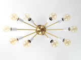 Bottom view of Oslo Sputnik ceiling light showcasing symmetrical ten-arm arrangement with white socket covers and exposed bulbs.