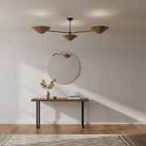 Oslo three cone chandelier with Mid-Century Modern brass shades, angled product view