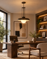 Palermo bronze dome pendant illuminating a sophisticated modern home office with a walnut desk, black leather chair, warm wooden bookshelves, and contemporary neutral decor.