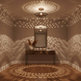 Palermo 5 light perforated metal bowl chandelier shown from an angled view with round ceiling canopy.