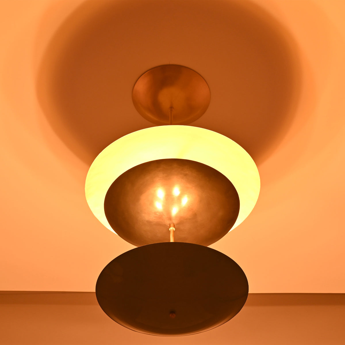 Palermo Tiered Saucer Chandelier close ceiling view with warm glow and layered circular shade design.