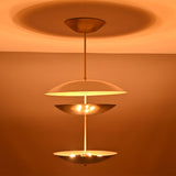 Palermo Tiered Saucer Chandelier illuminated side view showing three tiered saucer shades and soft ambient light.