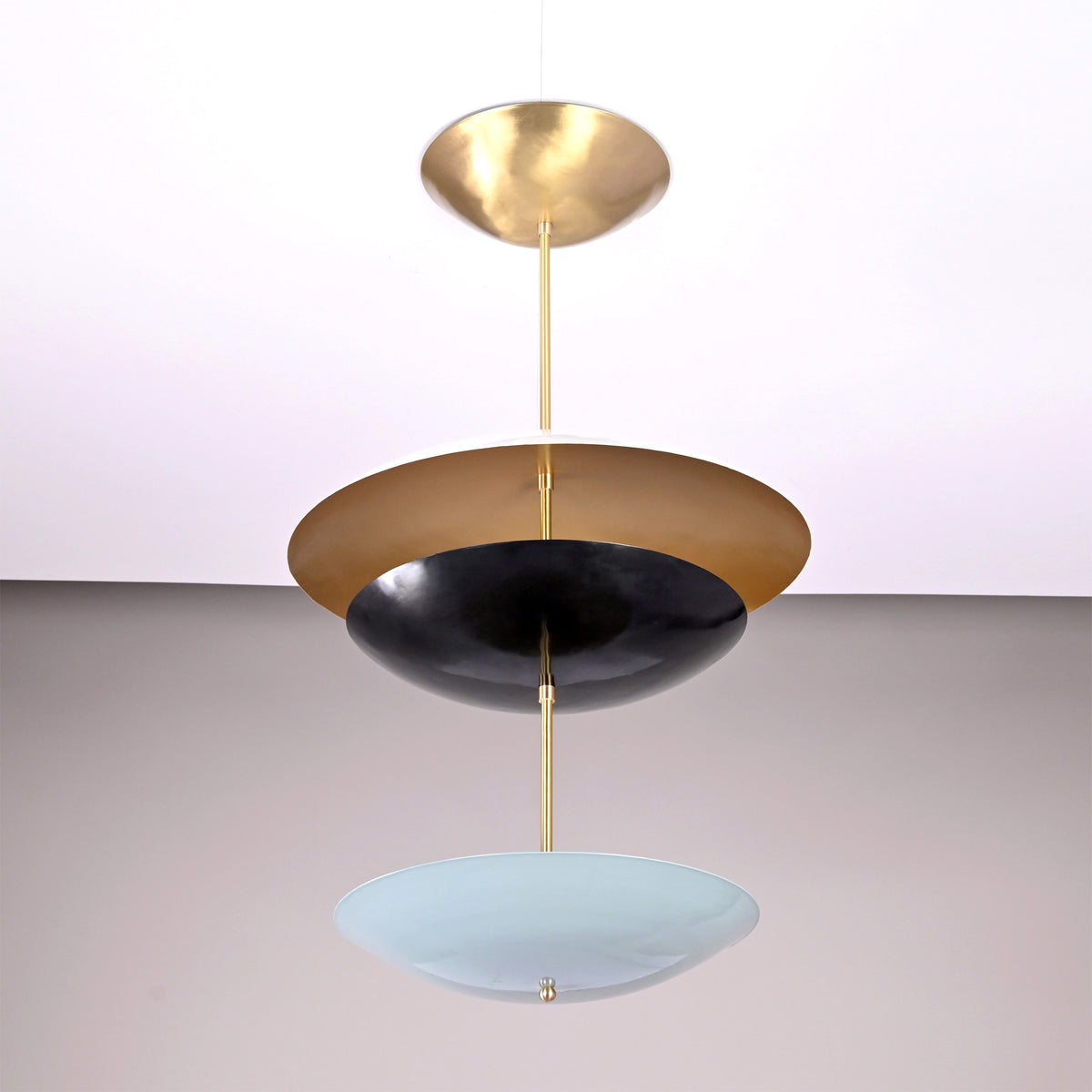 Palermo Tiered Saucer Chandelier angled product view with white, black, and pale blue layered shades.
