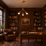 Paros 3 light brass chandelier featuring three geometric arms, cylindrical brass bulb holders and exposed globe bulbs.