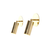 Modern brass adjustable spotlight wall sconce with cylindrical shade, round brass canopy, and clean contemporary design.