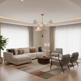 Perth 5 light Mid-Century Modern chandelier shown from the front with oversized cream cone shades and slender brass-tone arms.