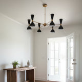 Portland 12 light Mid-Century chandelier shown from an alternate front view with black cone shades, white interiors, and a radial multi-arm frame.