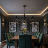 Portland 12 light Mid-Century Modern chandelier shown from the front with black double-cone shades and warm metallic radial arms.