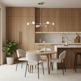 Porto 6 light sculptural cone chandelier shown from the front in a polished silver-tone finish with exposed white bulbs.