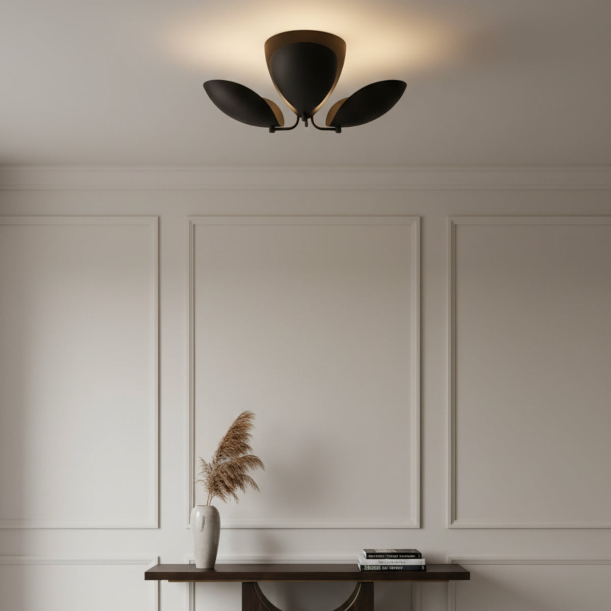 Positano 3 light dark finish chandelier shown from a straight front view with three curved petal-inspired metal shades.