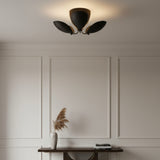 Positano 3 light dark finish chandelier shown from a straight front view with three curved petal-inspired metal shades.