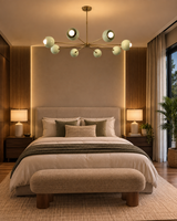 Provence 8 light mint green and brass chandelier displayed above a contemporary upholstered bed in a warm modern bedroom.