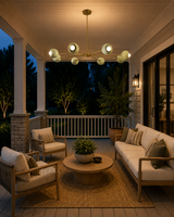 Provence 8 light mint green bowl chandelier illuminating a covered patio seating area with warm evening lighting.